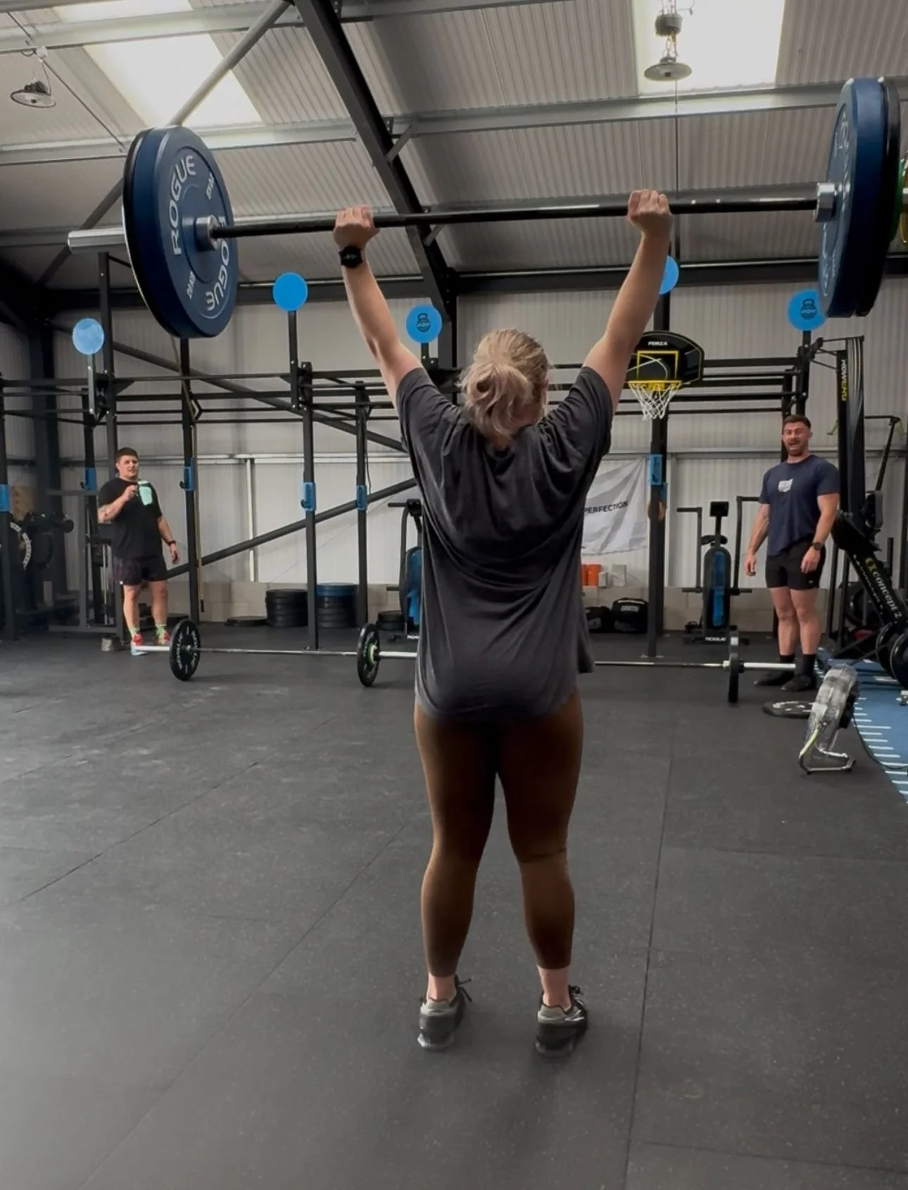 Coach Eb performing a strict press at Unity 4 Performance gym in Oswestry – strength training, functional fitness, and expert coaching in Shropshire